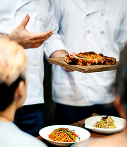 Chef serving fresh food for a chef's table experience in Phuket