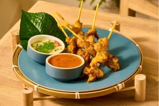 Free-range chicken satay with peanut sauce at Ocean Rhyme, a mild Thai food option for picky eaters