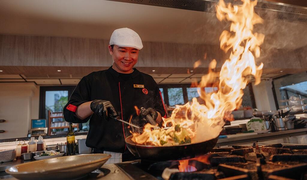 Chef cooking food in kitchen