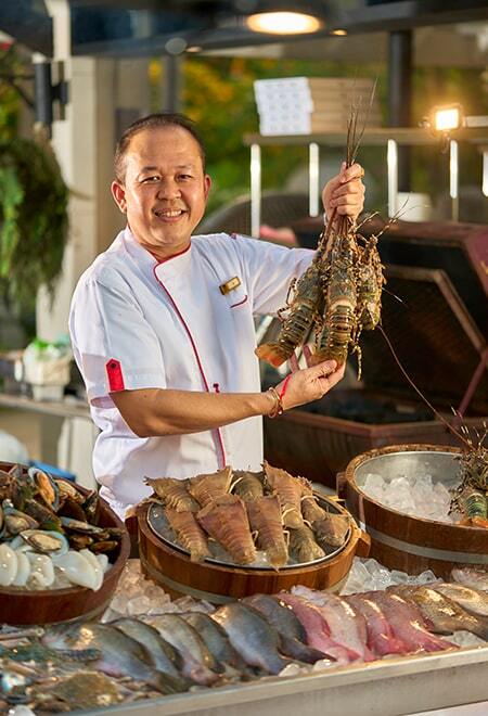 Chef holding lobsters at our Phuket, Thailand, restaurant